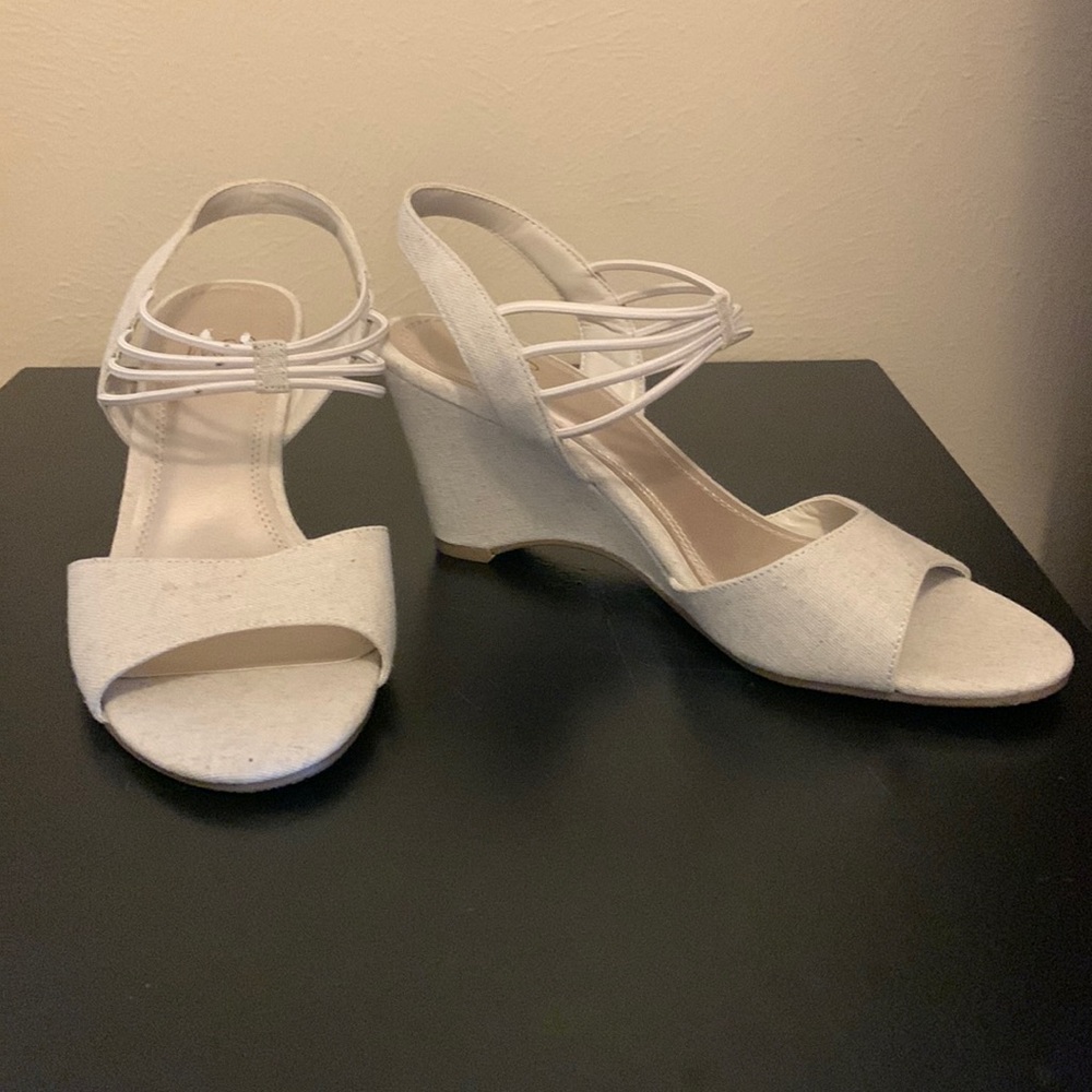 Wedge heel, brand new without tags. Never used. 3 inch heel